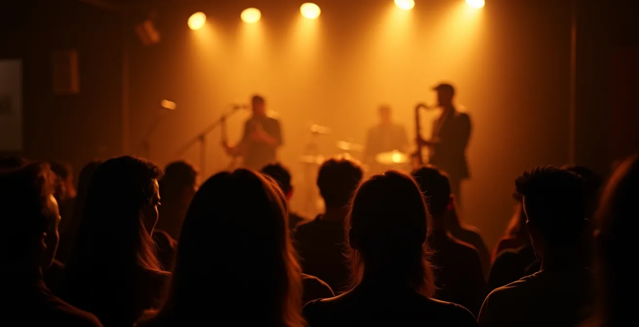 View from audience perspective of jazz club with warm lighting and musicians on stage